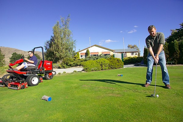 Mark Brooks mowing around Greg Turner at Queenstown Golf Club